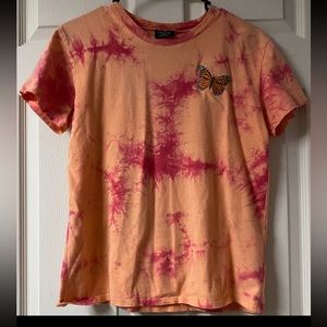 Orange and pink tie-dye shirt very much used size small brand Zumiez